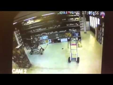 Wine Shelf Collapses On Clerk